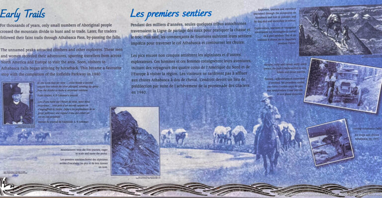 Blue bilingual interpretive panel with archival photographs, historical text, illustrations, and a decorative wave border.