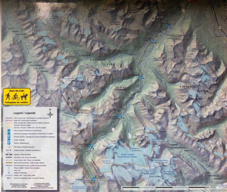 Detailed shaded-relief trail map with bilingual legend showing Jasper National Park and the Athabasca Pass region.