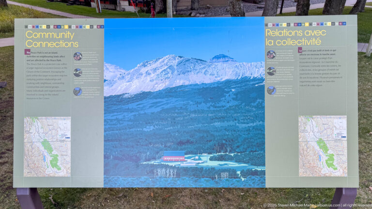 Bilingual Connections interpretive panel with a central mountain landscape photograph, explanatory text, and locator maps on both sides.