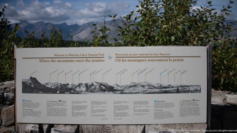 Interpretive panel titled Where the mountains meet the prairies with a labeled mountain skyline diagram and bilingual text.