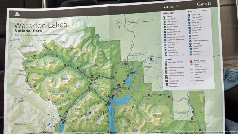 Waterton Lakes National Park visitor map showing lakes, roads, trails, facilities, and a detailed legend.