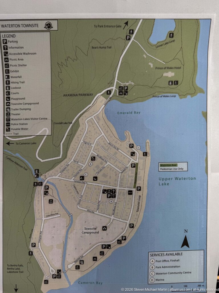 Visitor map of Waterton townsite beside Upper Waterton Lake, showing streets, bays, services, parking, and surrounding roads.